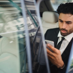 man in car on phone